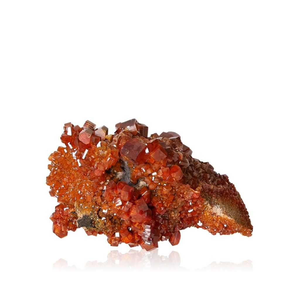 Red-orange Vanadinite Druze with glassy hexagonal crystals, enhances focus, motivation, and offers bold geometric visual appeal.